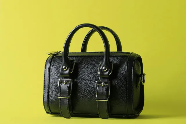 Black leather handbag with strap